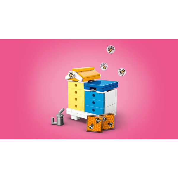 Блоковий конструктор LEGO Friends Будиночок і квітник бджолярів (42669)