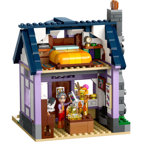 Блоковий конструктор LEGO Friends Будиночок і квітник бджолярів (42669)