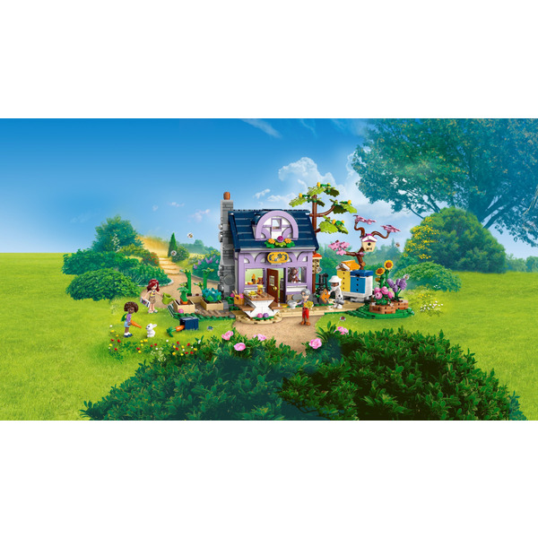 Блоковий конструктор LEGO Friends Будиночок і квітник бджолярів (42669)